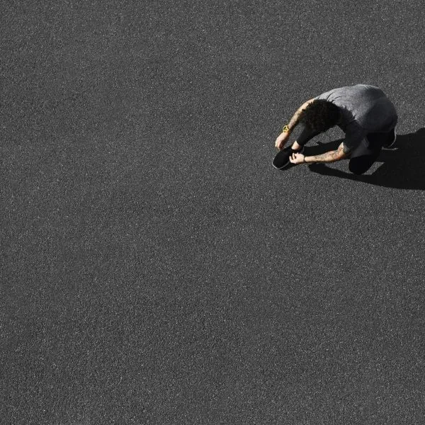 Top view jogging man runner tying running shoes before outdoor w