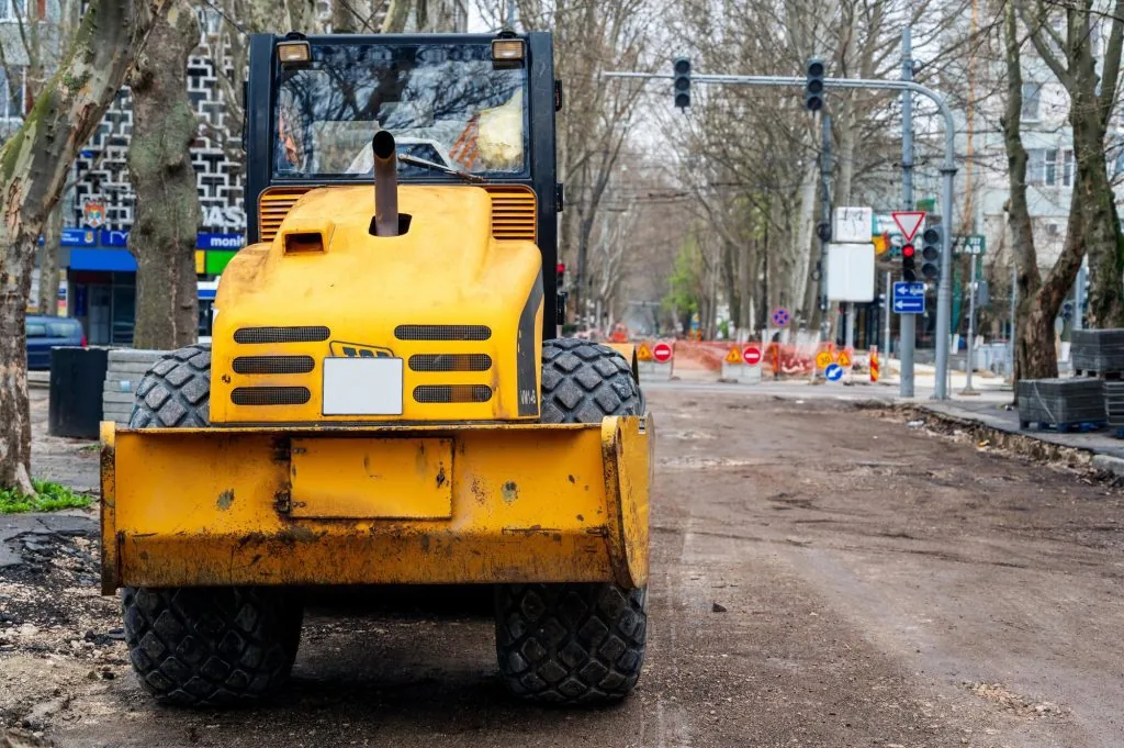 A bulldozer tearing up an old road in downtown Moldova, CO