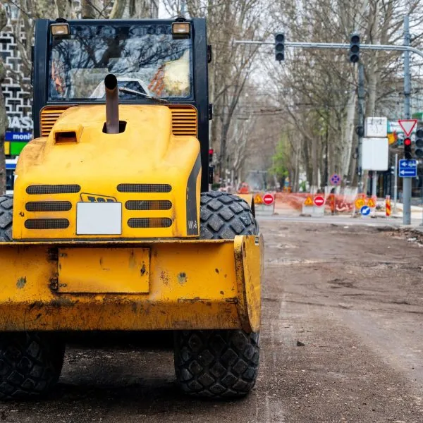 A bulldozer tearing up an old road in downtown Moldova, CO