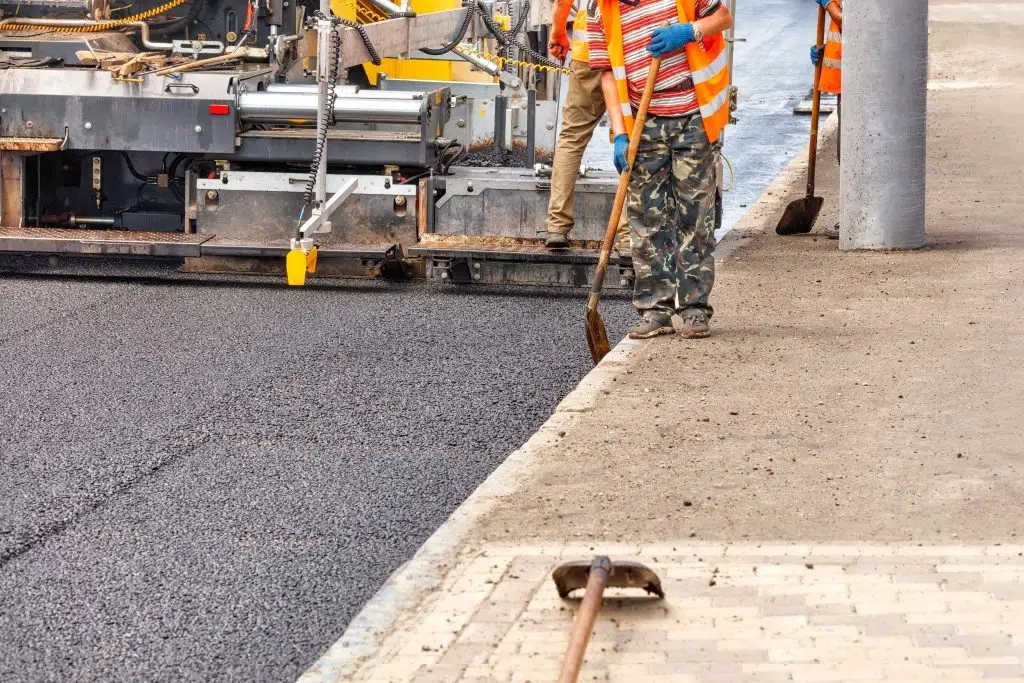 paving-fresh-asphalt-with-industrial-road-equipmen-2025-02-02-20-29-23-utc-1024x683 (1)