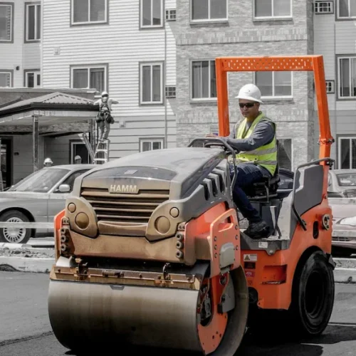 An NPP employee on an orange roller