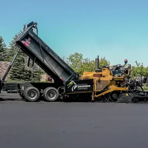 National Pavement Partners work on paving a new asphalt parking lot.